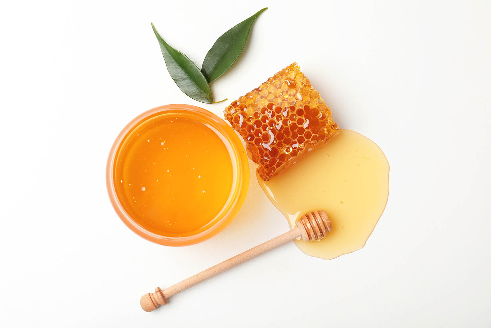 Honey in jar with honeycomb