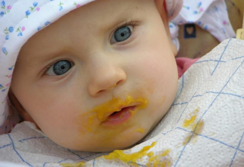 Baby with babyfood on face